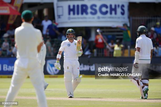 South Africa's batsman, Dean Elgar raises his bat to celebrate scoring a half-century during day two of the second Sunfoil Cricket Test match between...