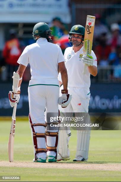 South Africa's batsman, Dean Elgar raises his bat to celebrate scoring a half-century during day two of the second Sunfoil Cricket Test match between...