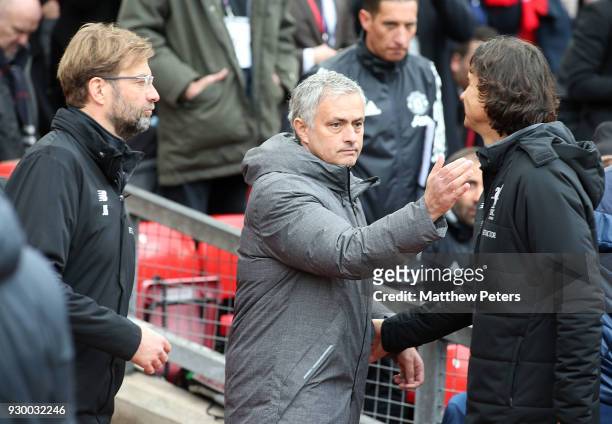 Manager Jose Mourinho of Manchester United greets Manager Jurgen Klopp of Liverpool ahead of the Premier League match between Manchester United and...