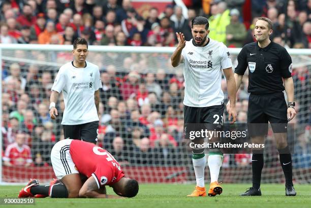 Antonio Valencia of Manchester United in action with Emre Can of Liverpool during the Premier League match between Manchester United and Liverpool at...