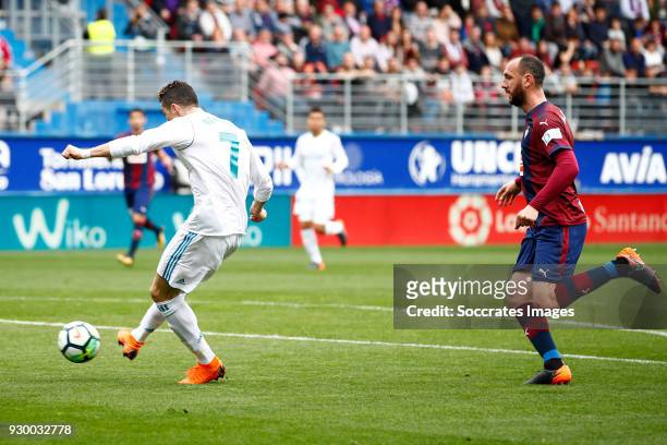 Cristiano Ronaldo of Real Madrid scores the first goal to make it 0-1 during the La Liga Santander match between Eibar v Real Madrid at the Estadio...