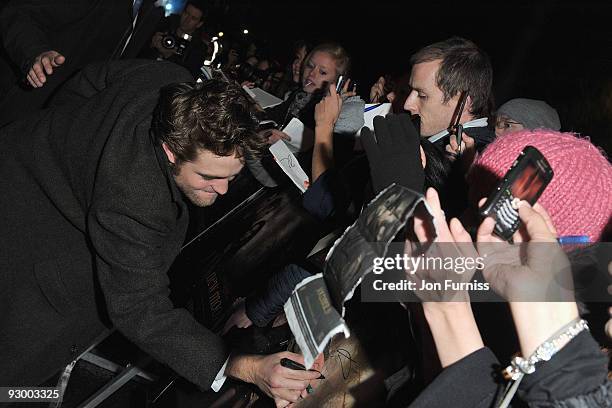 Actor Robert Pattinson signs autographs at The Twilight Saga: New Moon, UK fan event at Battersea Evolution on November 10, 2009 in London, England.