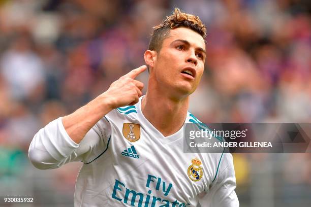 Real Madrid's Portuguese forward Cristiano Ronaldo celebrates after scoring a goal during the Spanish league football match between Eibar and Real...