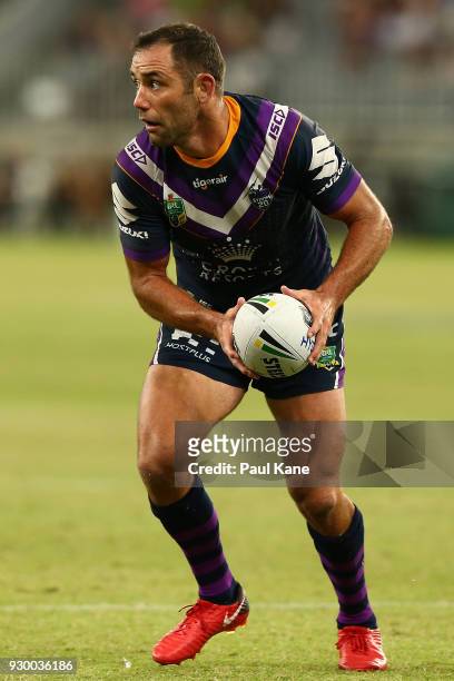 Cameron Smith of the Storm looks to pass the ball during the round one NRL match between the Canterbury Bulldogs and the Melbourne Storm at Optus...
