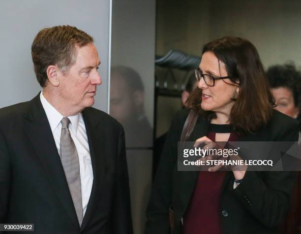 European Commissioner for Trade Cecilia Malmstrom speaks with US trade representative Robert Lighthizer as they arrive for a meeting for talks after...