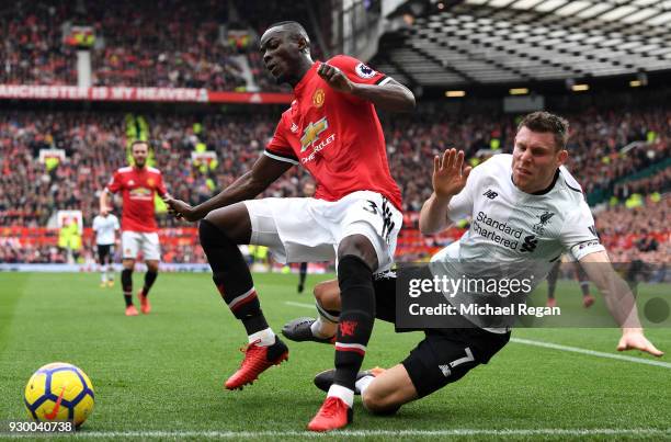 Eric Bailly of Manchester United and James Milner of Liverpool battle for the ball during the Premier League match between Manchester United and...
