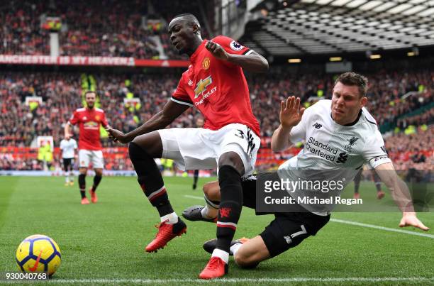 Eric Bailly of Manchester United and James Milner of Liverpool clash during the Premier League match between Manchester United and Liverpool at Old...