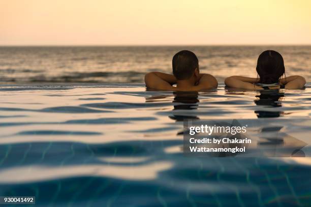 lovers in the pool by the sea. - chanthaburi sea fotografías e imágenes de stock