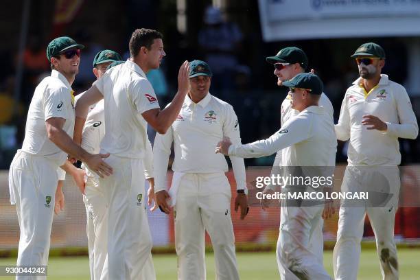 Australia's bowler Josh Hazlewood celebrates taking the wicket of South Africa's batsman Dean Elgar during day two of the second Sunfoil Cricket Test...