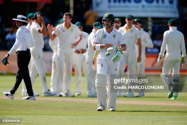 South Africa's batsman Dean Elgar leaves the ground after having been dismissed by Australia bowler Josh Hazlewood during day two of the second...
