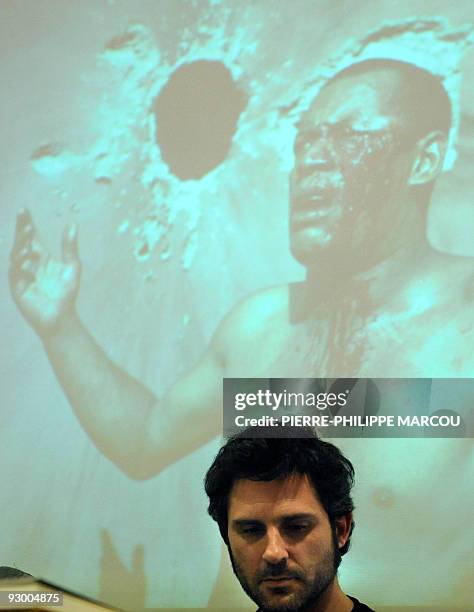 Spanish freelance photographer Jose Cendon gives a press conference during the presentation of his book "Billete de Ida" on November 12, 2009 in...