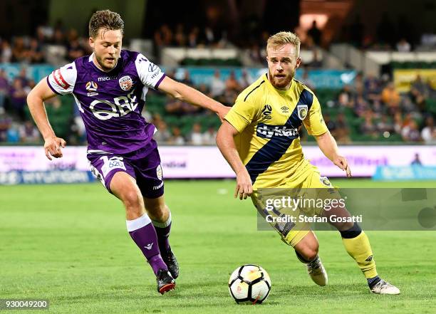 Connor Pain of the Mariners controls the ball against Chris Harold of the Glory during the round 22 A-League match between the Perth Glory and the...