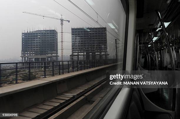 New metro train travels to Noida from the Akshardham Metro Station in New Delhi on November 12, 2009. Delhi Metro Rail Coorporation held a ceremonial...