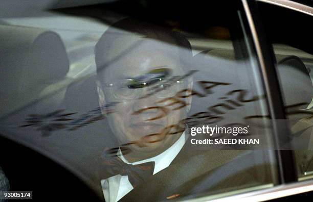 Sign of the forthcoming Asia-Pacific Economic Cooperation Summit meeting is reflected in the windows of a car carrying Hong Kong Chief Executive...