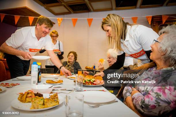 King Willem-alexander of The Netherlands and Queen Maxima of The Netherlands volunteer during the NL Doet at residential care centre 't Hofland in...