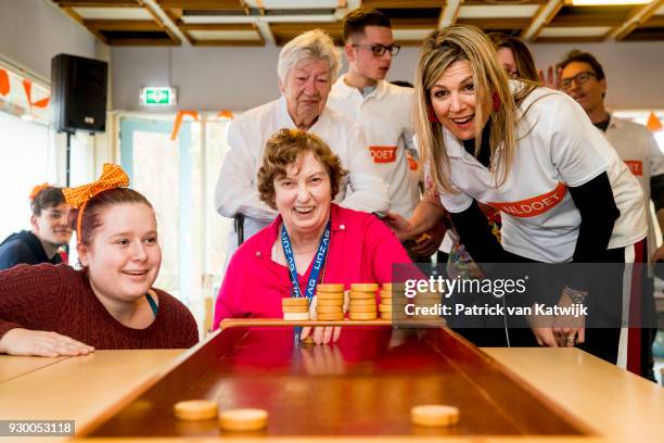 Queen Maxima of The Netherlands volunteers during the NL Doet at residential care centre 't Hofland in Pijnacker on March 10, 2018 in Pijnacker,...