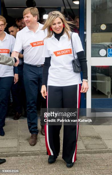 King Willem-alexander of The Netherlands and Queen Maxima of The Netherlands leave after volunteering during the NL Doet at residential care centre...
