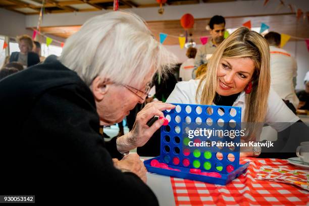 Queen Maxima of The Netherlands volunteers during the NL Doet at residential care centre 't Hofland in Pijnacker on March 10, 2018 in Pijnacker,...