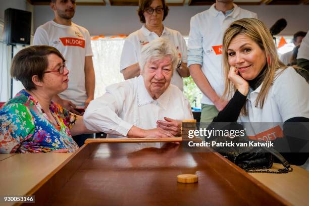 Queen Maxima of The Netherlands volunteers during the NL Doet at residential care centre 't Hofland in Pijnacker on March 10, 2018 in Pijnacker,...