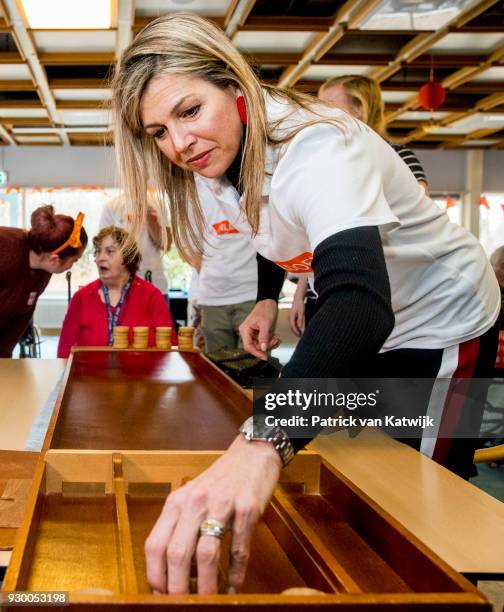 Queen Maxima of The Netherlands volunteers during the NL Doet at residential care centre 't Hofland in Pijnacker on March 10, 2018 in Pijnacker,...