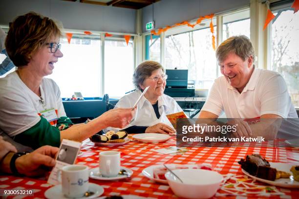 King Willem-alexander of The Netherlands volunteers during the NL Doet at residential care centre 't Hofland in Pijnacker on March 10, 2018 in...