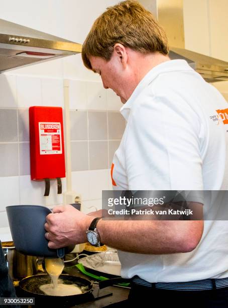 King Willem-alexander of The Netherlands and Queen Maxima of The Netherlands volunteer during the NL Doet at residential care centre 't Hofland in...