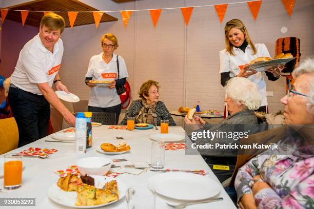 King Willem-alexander of The Netherlands and Queen Maxima of The Netherlands volunteer during the NL Doet at residential care centre 't Hofland in...