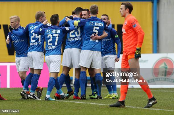 Pascal Breier of Rostock jubilates with team mates after scoring the second goal during the 3.Liga match between FC Hansa Rostock and SC Paderborn 07...