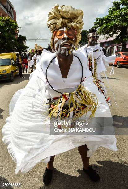 Members of the Afro-American group Jouvay Fest dance in a parade during the start of MASA in Abidjan on March 10, 2018. Created in 1993 under the...