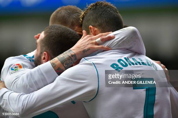 Real Madrid's Portuguese forward Cristiano Ronaldo celebrates with teammates after scoring his team's second goal during the Spanish league football...