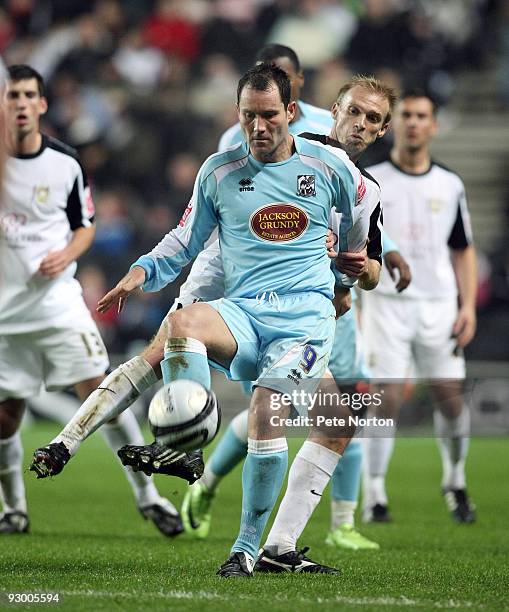 Steve Guinan of Northampton Town in action during the Johnstone's Paint Trophy Southern Area Quarter Final Match between MK Dons and Northampton Town...