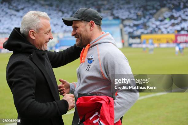 Head coach Pavel Dotchev of Rostock and head coach Steffen Baumgart of Paderborn look on prior to the 3.Liga match between FC Hansa Rostock and SC...