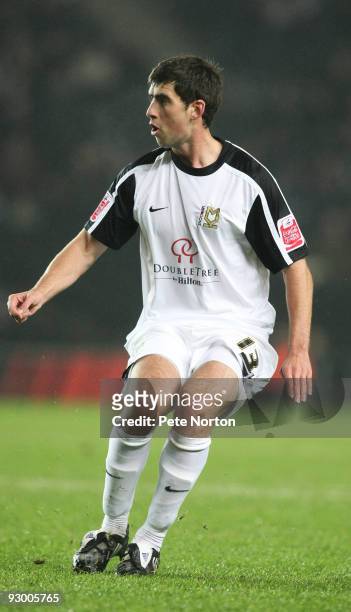 Mark Carrington of MK Dons in action during the Johnstone's Paint Trophy Southern Area Quarter Final Match between MK Dons and Northampton Town at...