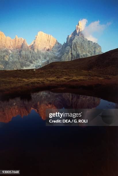 Panoramic view at sunset, Baita Segantini lake, the Campanili of Val Strut, Vezzana peak and the Cimon della Pala peak , Pale di San Martino Group,...