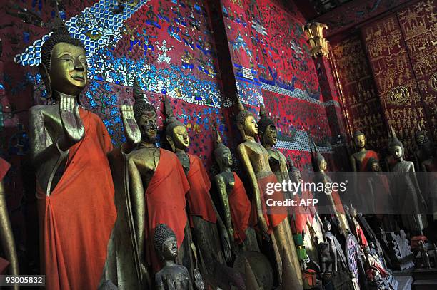 Buddha statues are seen inside Wat Xieng Thong, one of Luang Prabang's main temples, on October, 18 2009. The 700-year-old former capital, seen as...