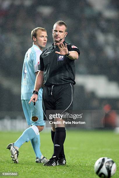 Referee Kevin Wright in action during the Johnstone's Paint Trophy Southern Area Quarter Final Match between MK Dons and Northampton Town at...