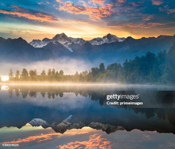 beautiful scenery landscape of the matheson lake fox glacier town southern alps mountain valleys new zealand - cordilheira imagens e fotografias de stock