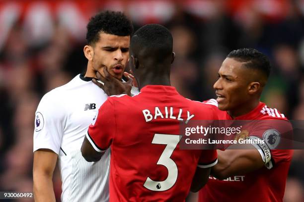 Eric Bailly of Manchester United clahses with Dominic Solanke of Liverpool during the Premier League match between Manchester United and Liverpool at...