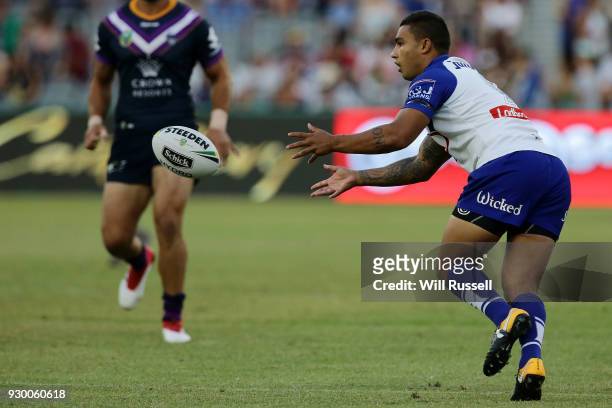 Michael Lichaa of the Bulldogs passes the ball during the round one NRL match between the Canterbury Bulldogs and the Melbourne Storm at Optus...