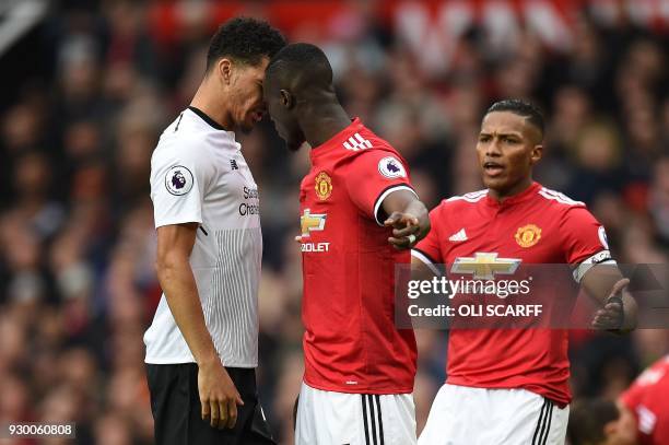 Manchester United's Ivorian defender Eric Bailly confronts Liverpool's English striker Dominic Solanke during the English Premier League football...