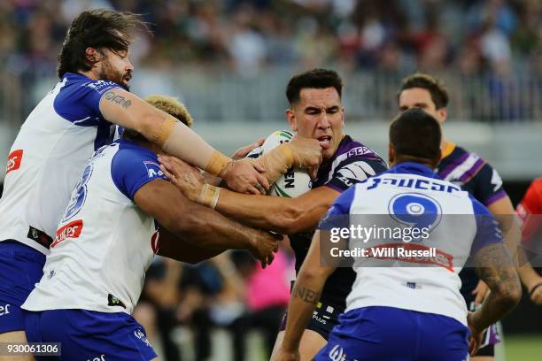 Nelson Asofa-Solomona of the Storm is tackled during the round one NRL match between the Canterbury Bulldogs and the Melbourne Storm at Optus Stadium...