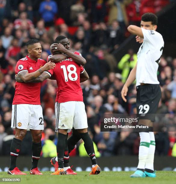 Antonio Valencia, Eric Bailly and Ashley Young of Manchester United celebrate after the Premier League match between Manchester United and Liverpool...