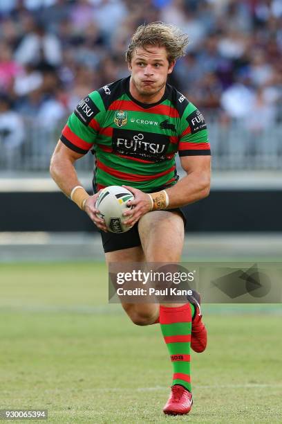 George Burgess of the Rabbitohs runs the ball during the round one NRL match between the South Sydney Rabbitohs and the New Zealand Warriors at Optus...