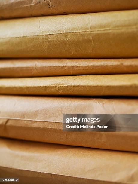 stack of manila envelopes or packages - manila envelope stock pictures, royalty-free photos & images