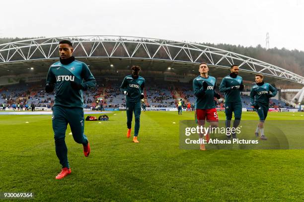 Luciano Narsingh, Tammy Abraham and Connor Roberts, Kyle Bartley and Tom Carroll of Swansea City warm up prior to the game during the Premier League...