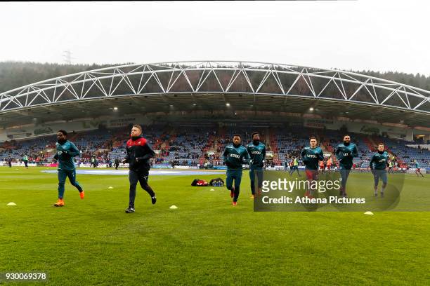 Nathan Dyer, coach Eddie Lattimore, Luciano Narsingh, Tammy Abraham and Connor Roberts of Swansea City warm up prior to the game during the Premier...