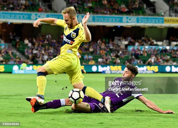 Scott Neville of the Glory attacks the ball against Connor Pain of the Mariners during the round 22 A-League match between the Perth Glory and the...