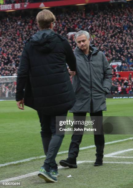 Manager Jose Mourinho of Manchester United shakes hands with Manager Jurgen Klopp of Liverpool after the Premier League match between Manchester...