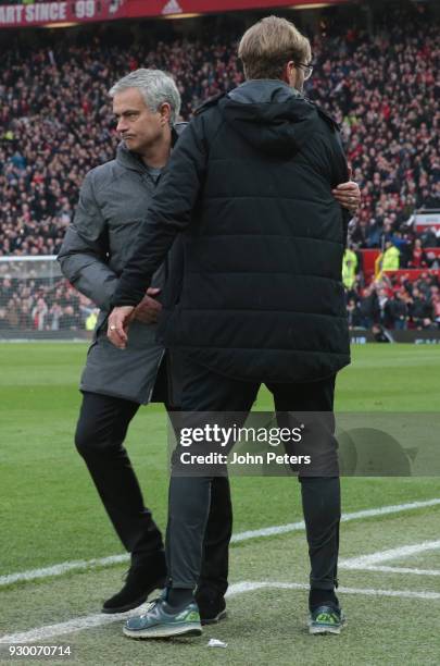 Manager Jose Mourinho of Manchester United shakes hands with Manager Jurgen Klopp of Liverpool after the Premier League match between Manchester...