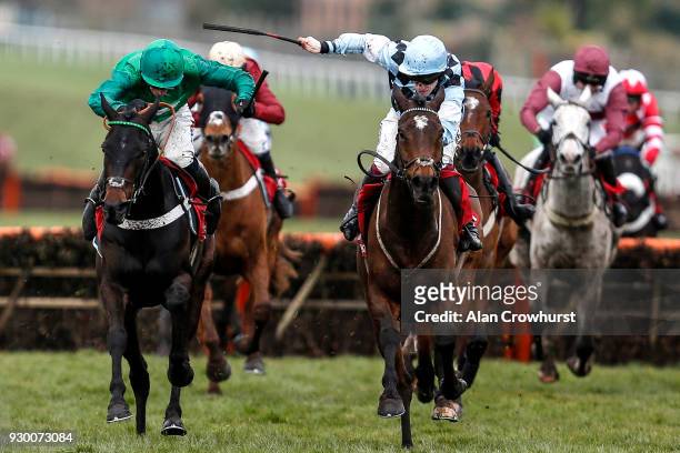 Jamie Bargary riding Mr Antolini win The Matchbook Imperial Cup Handicap Hurdle Race from Call Me Lord and Daryl Jacob at Sandown Park racecourse on...